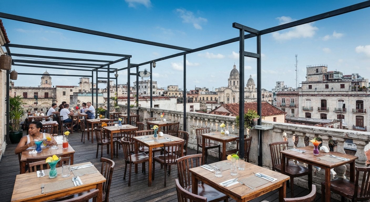 the rooftop terrace at El del Frente on O'Reilly 303, tables set under open sky with cocktails and Old Havana rooftops in the background